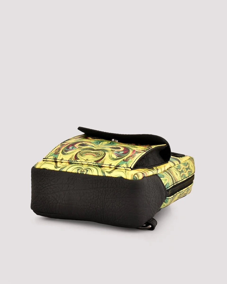 Detailed stitching craftsmanship on travel sling bag on a light gray background