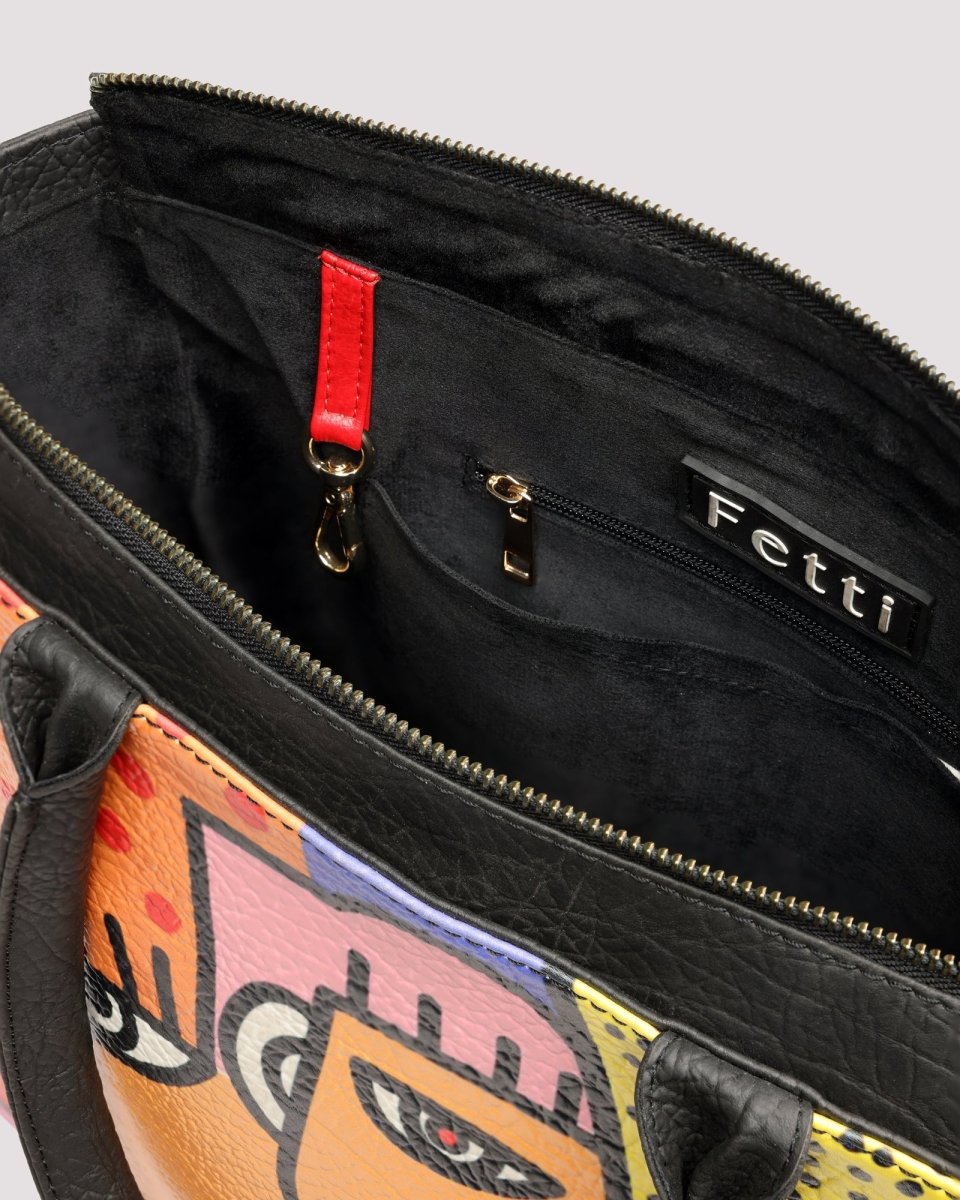 Interior pocket and spacious compartment of tote bag