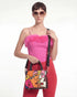 Woman holding a colorful Vegan tote bag Mini FETTI Faces on a white background